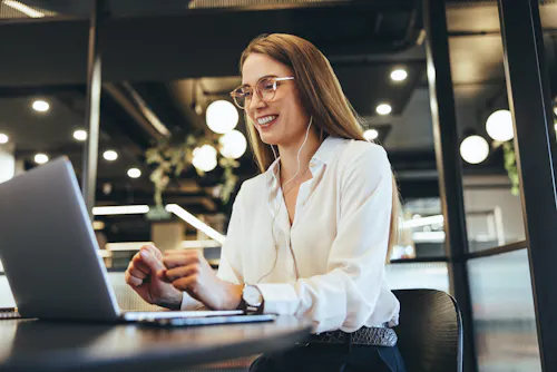 Blonde woman with glasses on a video call