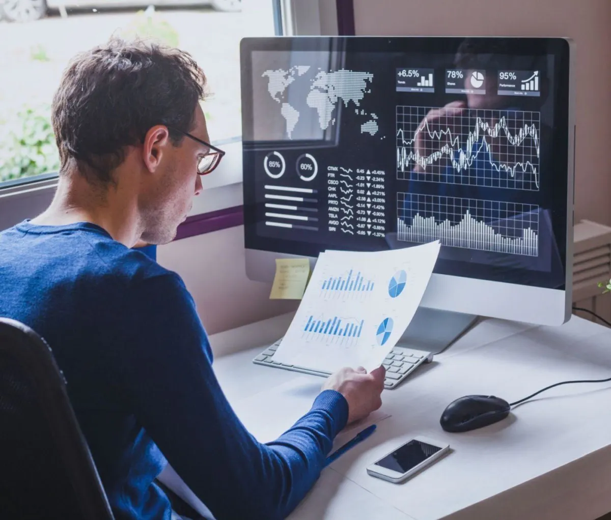 Man looking at data screen