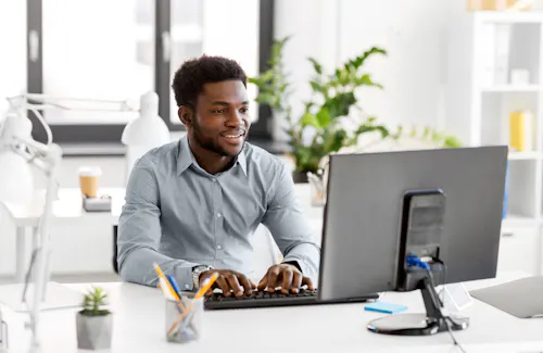 Man working at computer desk