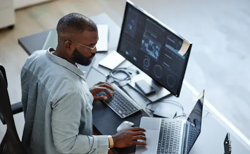 Man working with AI algorithms at desk