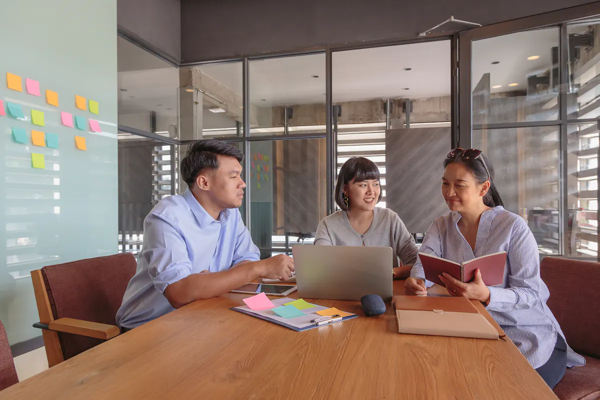 A business team plans product management strategy in a nice office.