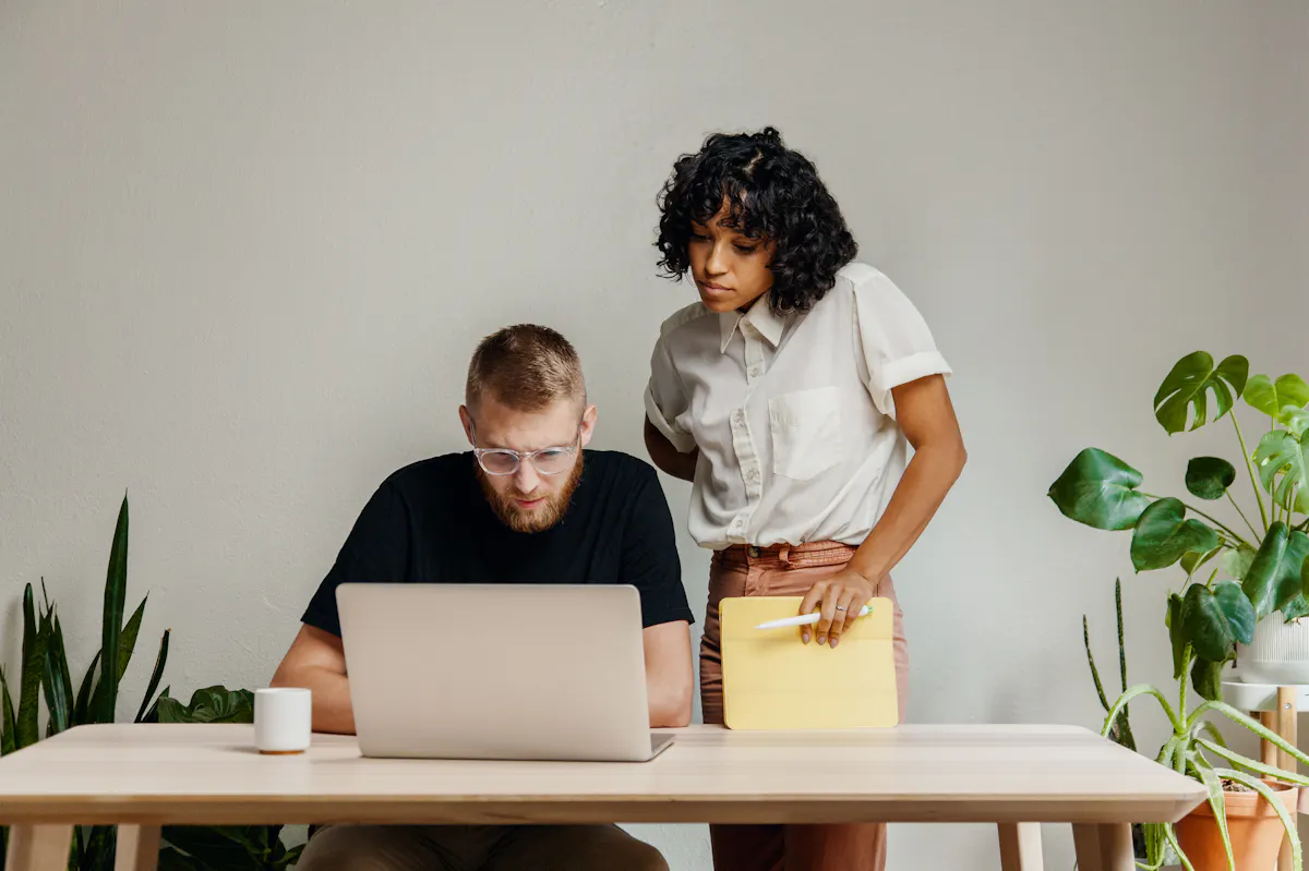 Man and woman collaborating in tech industry