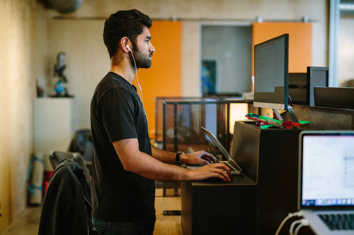 Man at standing desk working