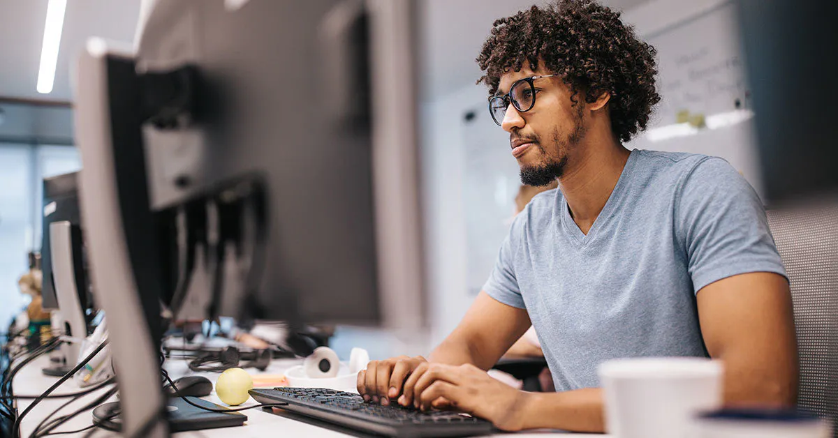 Man staring at computer wide