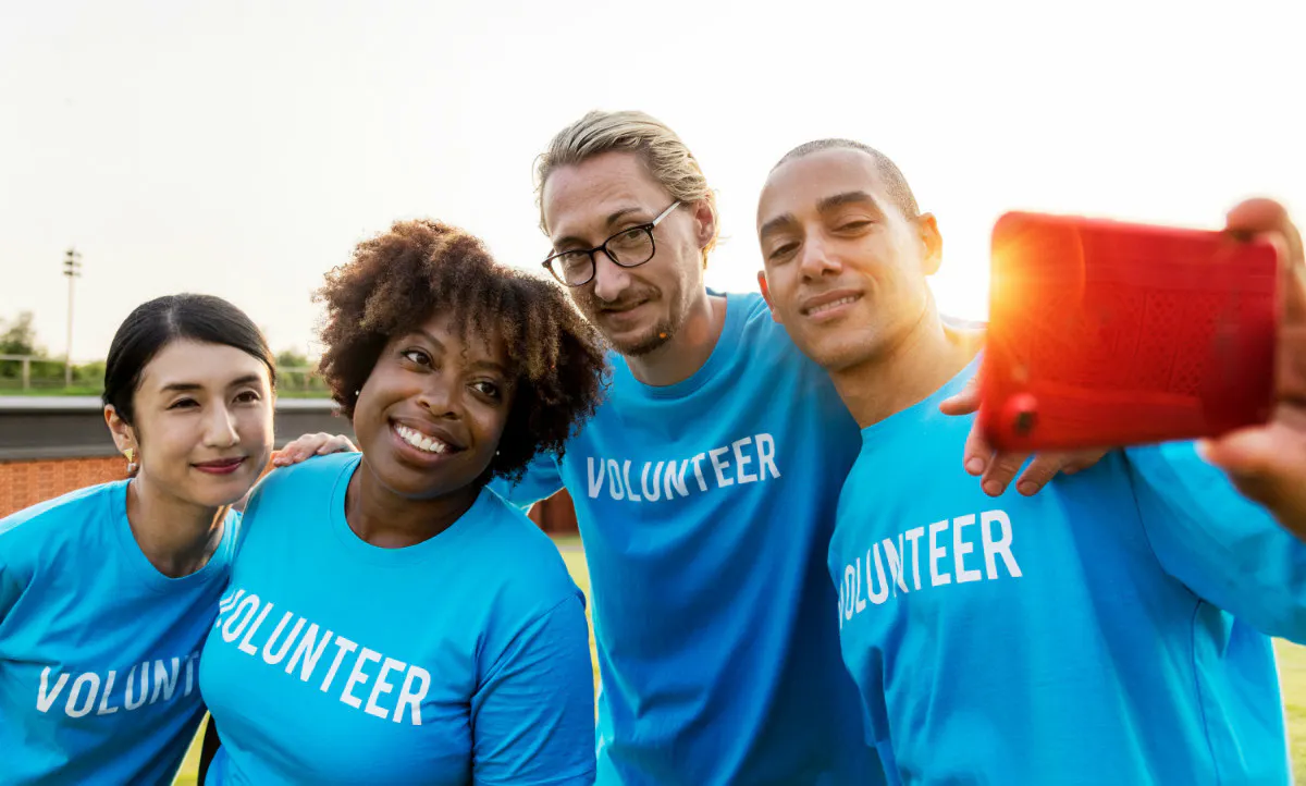 Team of nonprofit volunteers taking a selfie