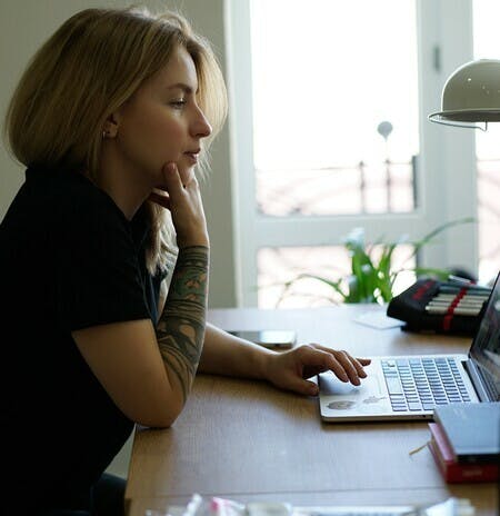 Woman computer desk bright