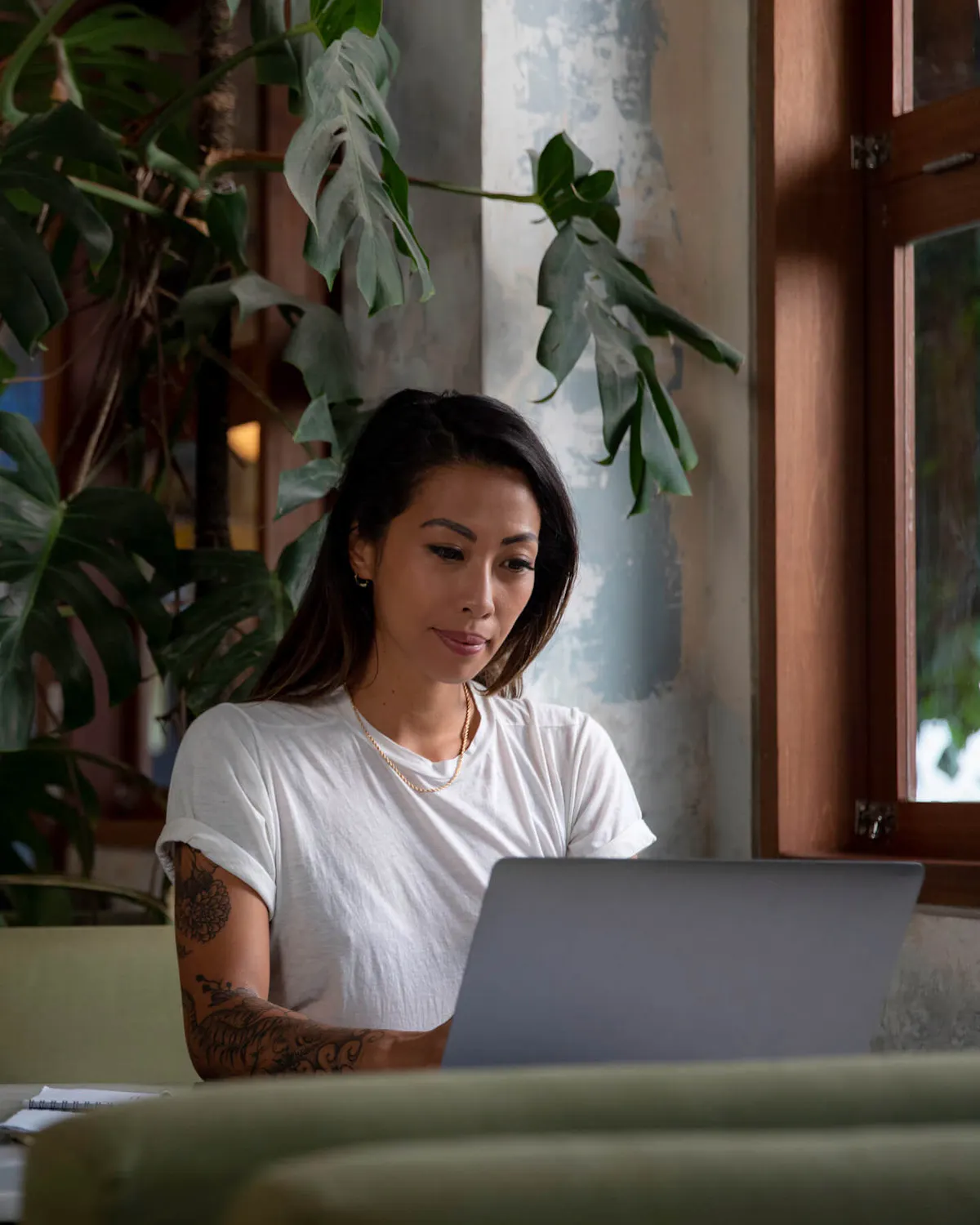 Woman in coffee shop typing