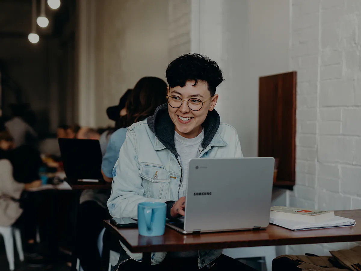 Woman laughing while working