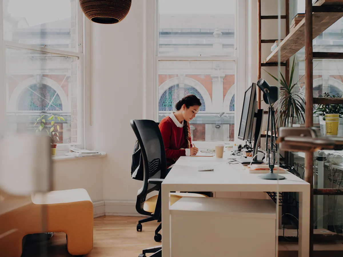 Woman working at long desk