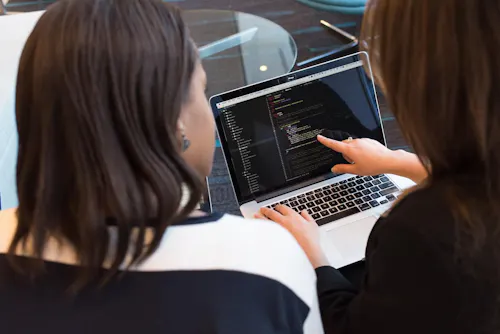 Women pointing at laptop