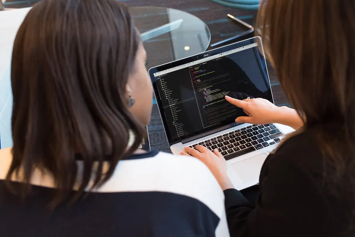 Women pointing at laptop