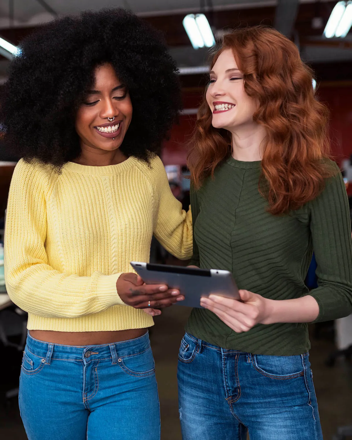 Women smiling over ipad