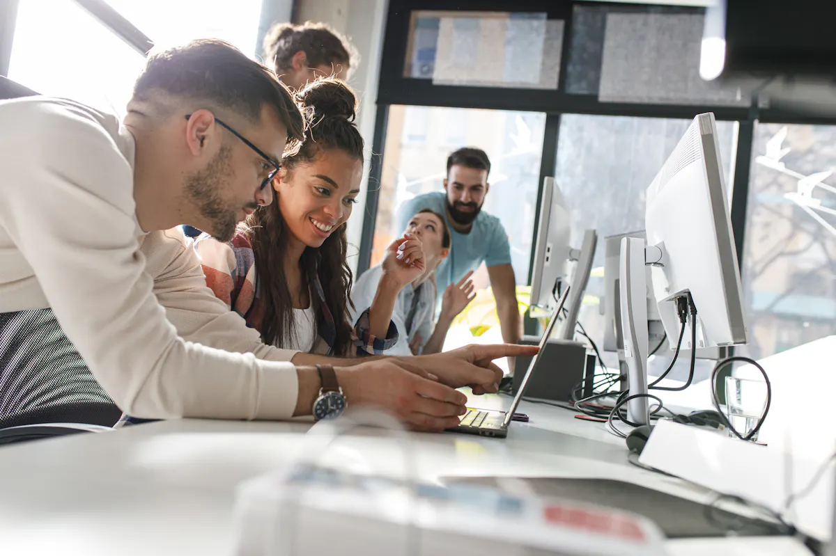 Group working at laptop together